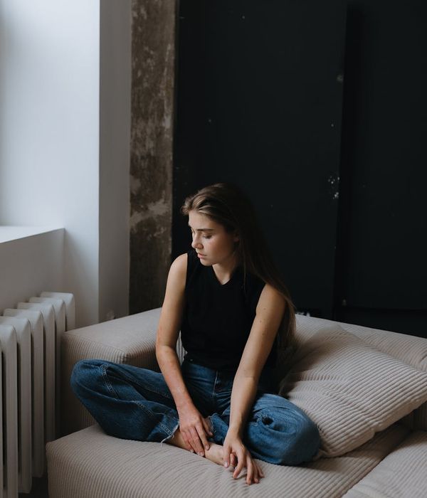 Woman in a calm meditation pose, radiating tranquility.